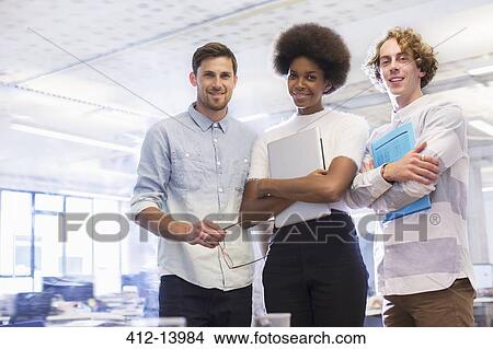 Picture - Business people smiling in office. Fotosearch