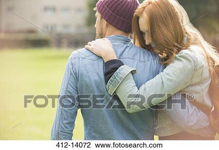 Couple hugging in park View Large Photo Image Stock Image - Couple hugging in park. Fotosearch