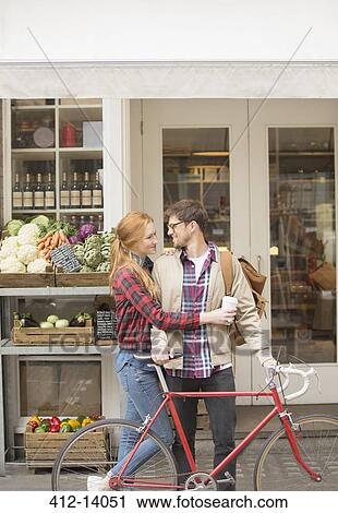 Couple hugging on city street View Large Photo Image Stock Image - Couple hugging on city street. Fotosearch