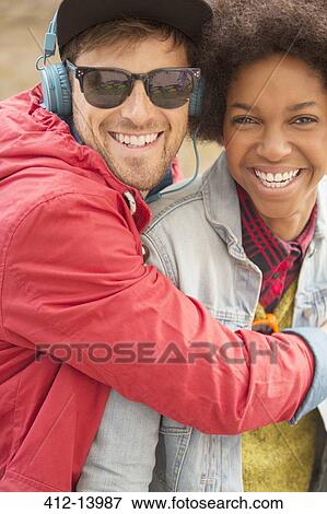 Couple hugging outdoors View Large Photo Image Stock Photo - Couple hugging outdoors. Fotosearch