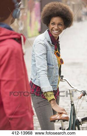 Stock Photo - Couple walking together on city street. Fotosearch