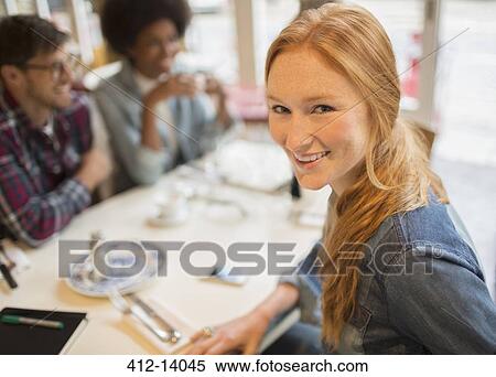 Friends enjoying coffee in cafe View Large Photo Image Stock Photography - Friends enjoying coffee in cafe. Fotosearch