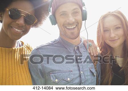 Friends smiling together outdoors View Large Photo Image Picture - Friends smiling together outdoors. Fotosearch