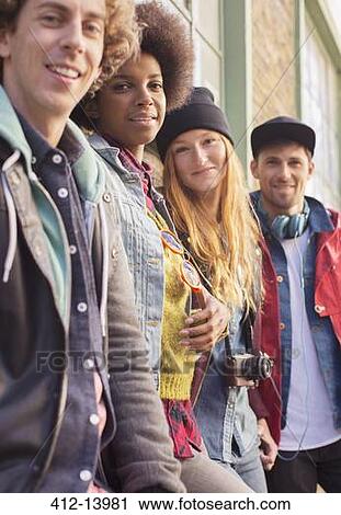 Friends standing together View Large Photo Image Stock Image - Friends standing together. Fotosearch