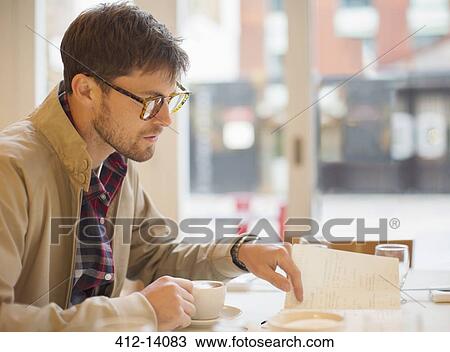 Man drinking coffee in cafe View Large Photo Image Stock Image - Man drinking coffee in cafe. Fotosearch