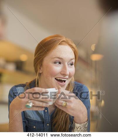 Woman drinking coffee in cafe View Large Photo Image Stock Image - Woman drinking coffee in cafe. Fotosearch