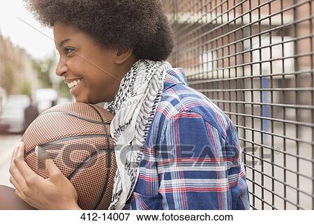 Woman holding basketball outdoors View Large Photo Image Stock Photo - Woman holding basketball outdoors. Fotosearch