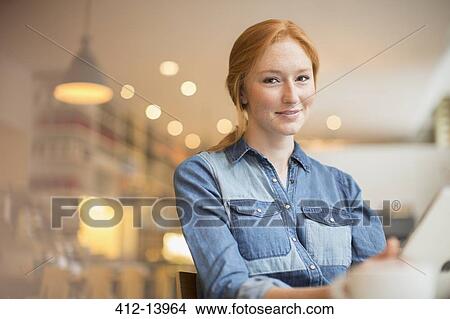 Woman holding menu in cafe View Large Photo Image Picture - Woman holding menu in cafe. Fotosearch