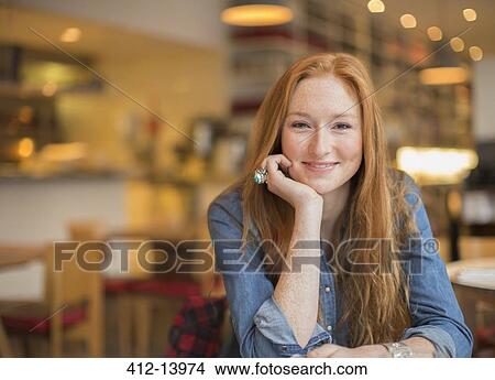 Woman smiling in cafe View Large Photo Image Picture - Woman smiling in cafe. Fotosearch
