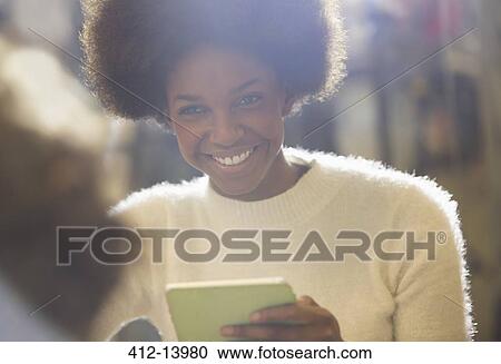 Woman using digital tablet View Large Photo Image Stock Image - Woman using digital tablet. Fotosearch