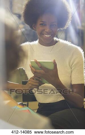 Woman using digital tablet View Large Photo Image Stock Photography - Woman using digital tablet. Fotosearch