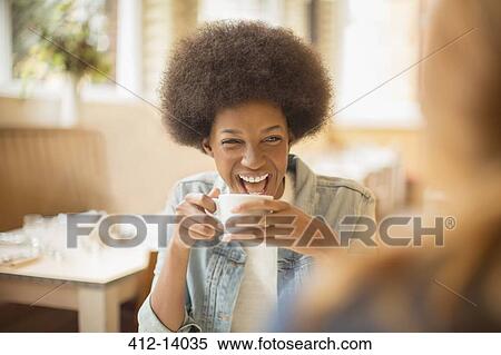 Stock Photography - Women drinking coffee in cafe. Fotosearch