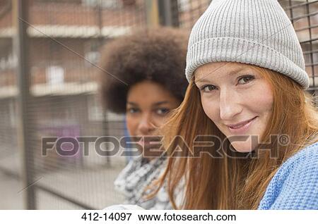 Stock Photo - Women smiling outdoors. Fotosearch