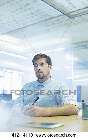Businessman taking notes in meeting View Large Photo Image Stock Image - Businessman taking notes in meeting. Fotosearch