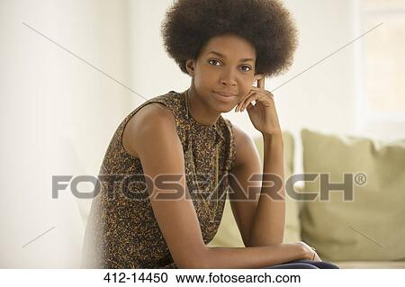 Businesswoman sitting on sofa View Large Photo Image Stock Image - Businesswoman sitting on sofa. Fotosearch