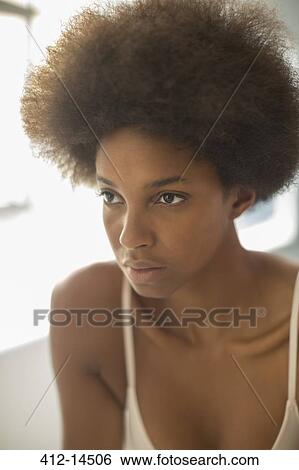 Stock Photograph - Close up of woman's serious face. Fotosearch