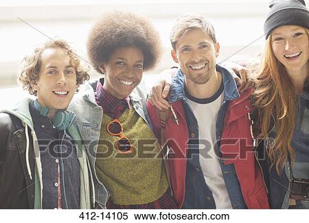 Stock Photography - Friends smiling together outdoors. Fotosearch