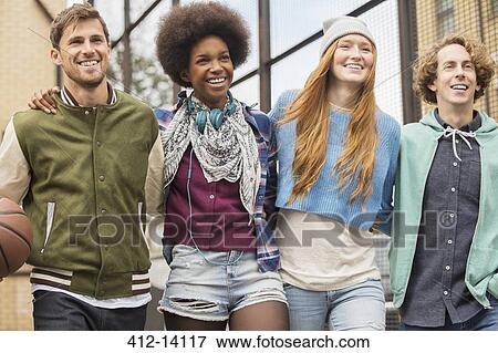 Friends walking together with basketball View Large Photo Image Stock Photo - Friends walking together with basketball. Fotosearch