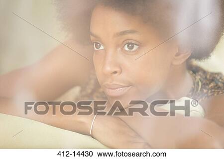 Woman resting chin in hands View Large Photo Image Stock Image - Woman resting chin in hands. Fotosearch