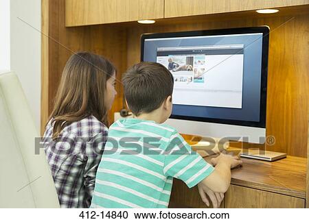 Children using computer together View Large Photo Image Stock Image - Children using computer together. Fotosearch