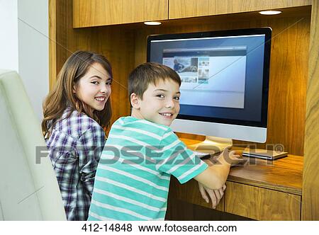 Children using computer together View Large Photo Image Stock Photo - Children using computer together. Fotosearch