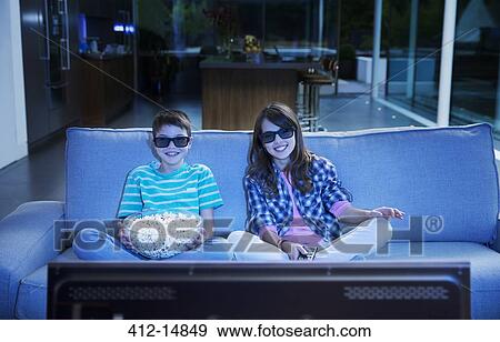 Children watching 3D television in living room View Large Photo Image Stock Photo - Children watching 3D television in living room. Fotosearch