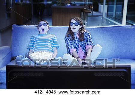 Children watching 3D television in living room View Large Photo Image Stock Photography - Children watching 3D television in living room. Fotosearch