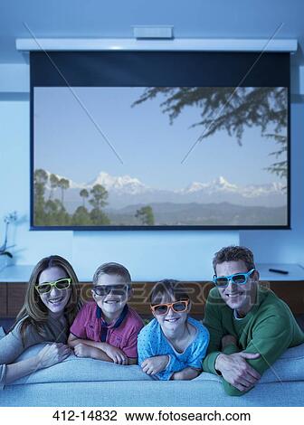 Family watching 3D television in living room View Large Photo Image Stock Image - Family watching 3D television in living room. Fotosearch