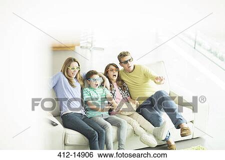 Family watching 3D television in living room View Large Photo Image Stock Photograph - Family watching 3D television in living room. Fotosearch
