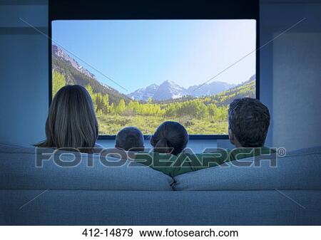 Family watching television in living room View Large Photo Image Stock Photo - Family watching television in living room. Fotosearch