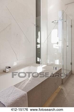 Bathtub and shower in modern bathroom View Large Photo Image Stock Photograph - Bathtub and shower in modern bathroom. Fotosearch
