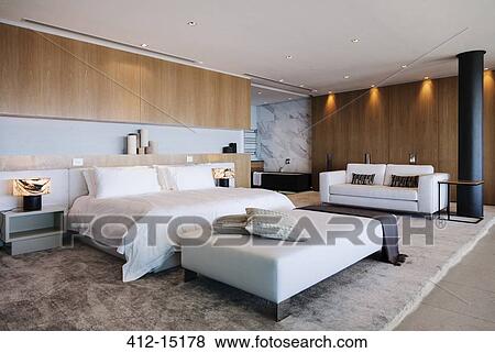 Bed and sofa in modern bedroom View Large Photo Image Stock Photo - Bed and sofa in modern bedroom. Fotosearch
