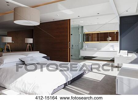 Picture - Bedroom and en suite bathroom in modern house. Fotosearch