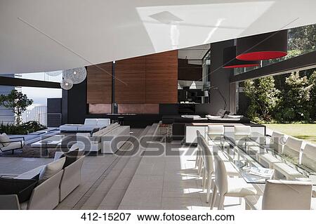 Stock Photo - Dining and living rooms in modern house. Fotosearch