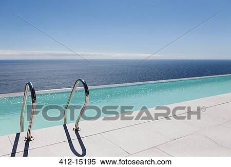 Infinity pool overlooking ocean View Large Photo Image Stock Photography - Infinity pool overlooking ocean. Fotosearch