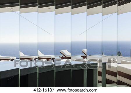 Lounge chair and balcony reflected in mirror View Large Photo Image Stock Photo - Lounge chair and balcony reflected in mirror. Fotosearch