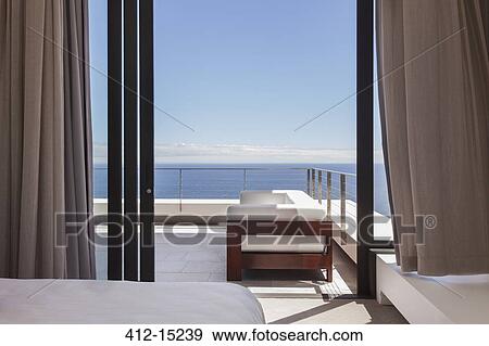Stock Photo - Modern balcony overlooking ocean. Fotosearch