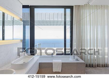 Modern bathroom overlooking ocean View Large Photo Image Stock Photo - Modern bathroom overlooking ocean. Fotosearch