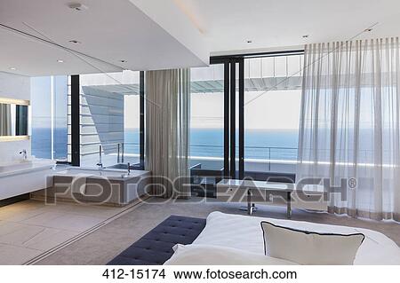 Picture - Modern bedroom overlooking ocean. Fotosearch