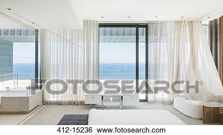 Modern bedroom overlooking ocean View Large Photo Image Stock Photograph - Modern bedroom overlooking ocean. Fotosearch