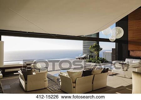 Modern living room overlooking ocean View Large Photo Image Stock Photograph - Modern living room overlooking ocean. Fotosearch