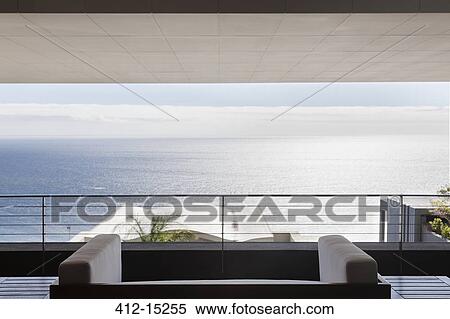 Stock Photography - Modern patio overlooking ocean. Fotosearch