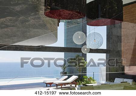 Patio of modern house overlooking ocean View Large Photo Image Stock Photo - Patio of modern house overlooking ocean. Fotosearch