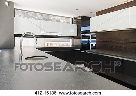 Sink and counters in modern kitchen View Large Photo Image Stock Photograph - Sink and counters in modern kitchen. Fotosearch