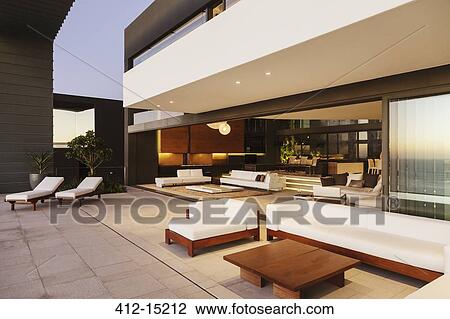 Sofas and lounge chairs on modern patio View Large Photo Image Stock Image - Sofas and lounge chairs on modern patio. Fotosearch
