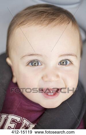 Stock Photo - Close up of baby boy's smiling face. Fotosearch