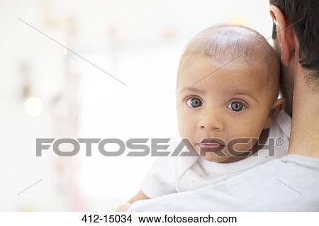Father carrying baby boy View Large Photo Image Picture - Father carrying baby boy. Fotosearch