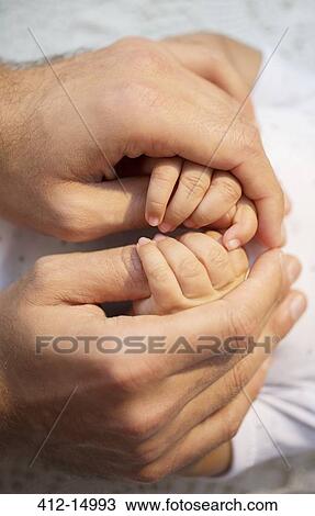 Father holding baby boy's hands View Large Photo Image Stock Image - Father holding baby boy's hands. Fotosearch