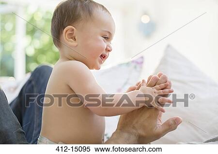 Father playing with baby boy View Large Photo Image Stock Photography - Father playing with baby boy. Fotosearch