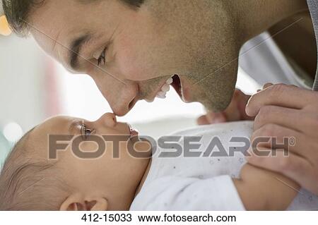 Father rubbing noses with baby boy View Large Photo Image Stock Image - Father rubbing noses with baby boy. Fotosearch
